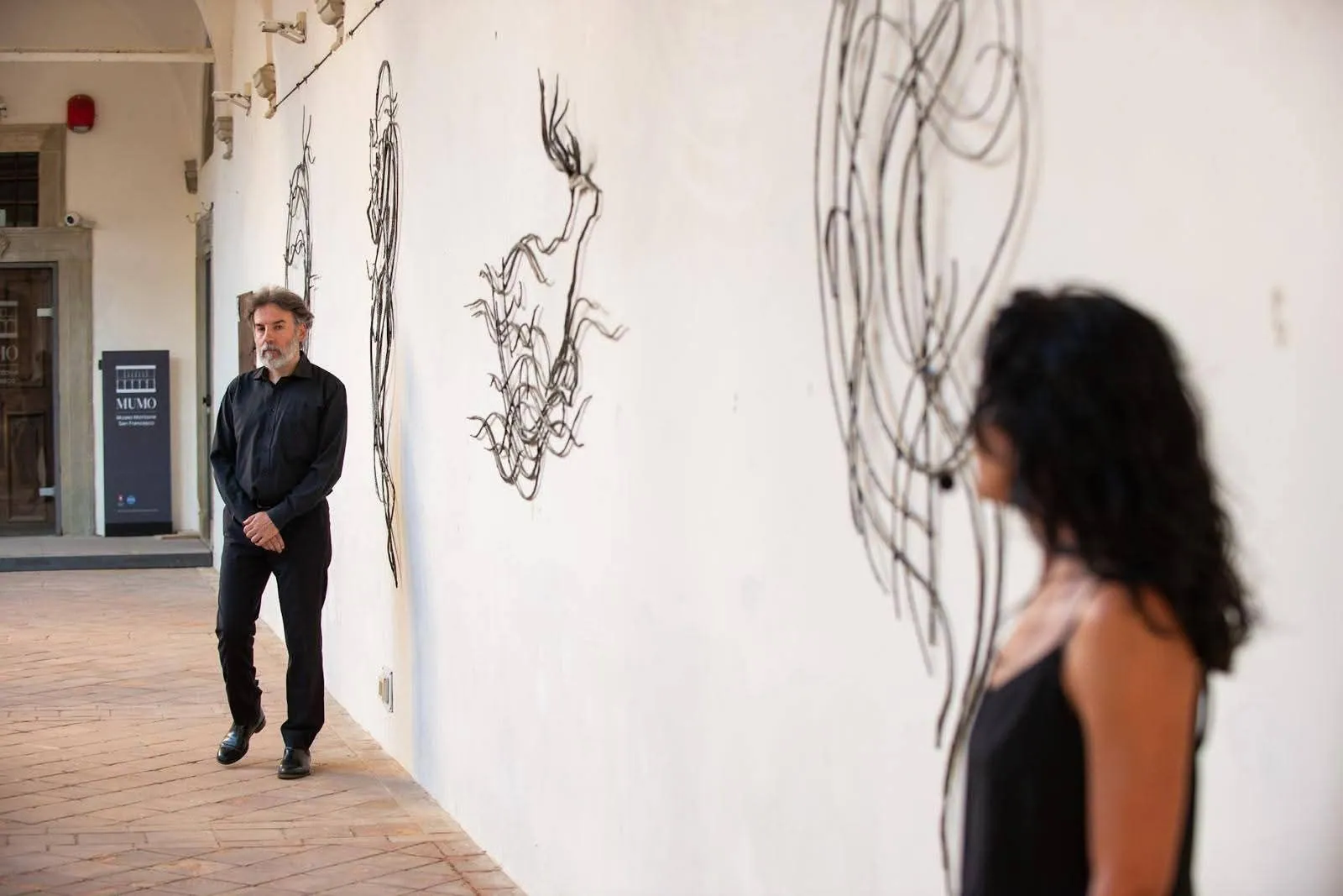The Metamorfosi sculptures in the Cloister of San Francesco in Montone, during a concert